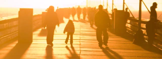 image of family on pier in sunset